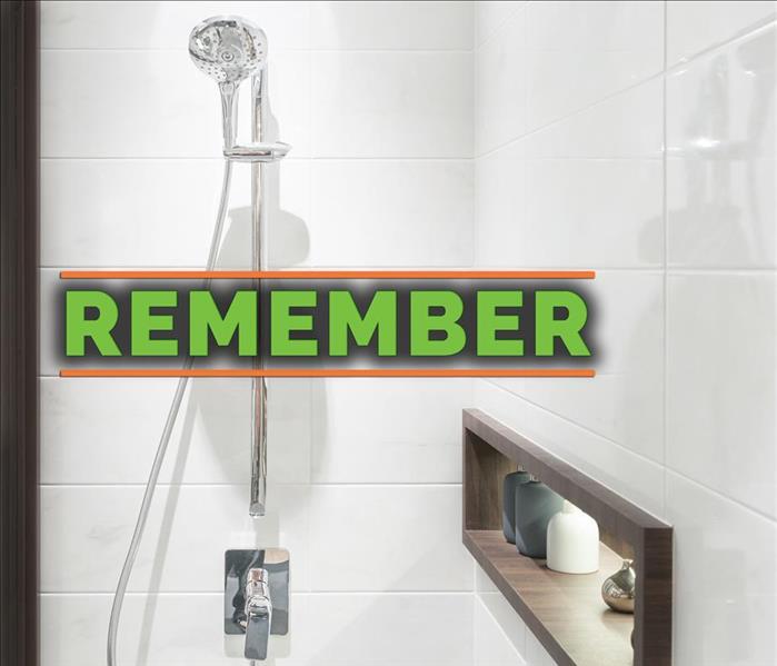 Shower of a bathroom with the phrase REMEMBER